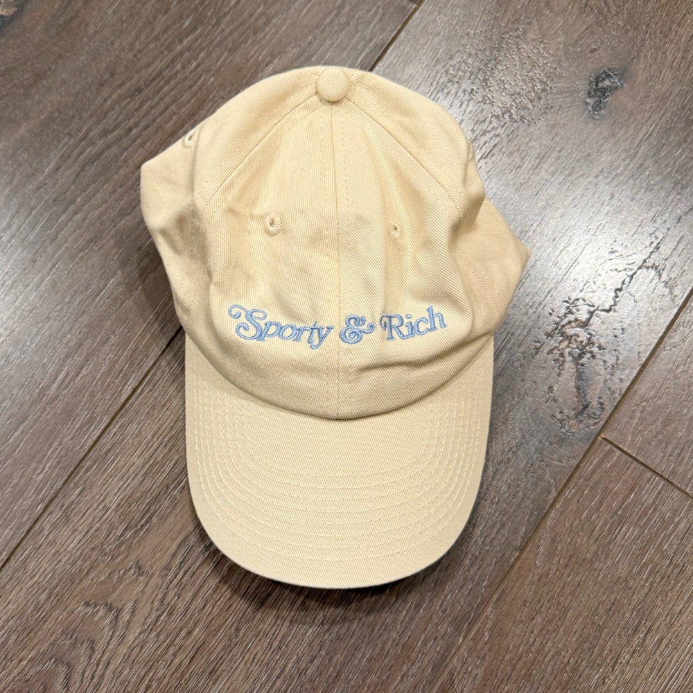 Sporty & Rich Beige Dad Hat with Light Blue Embroidery